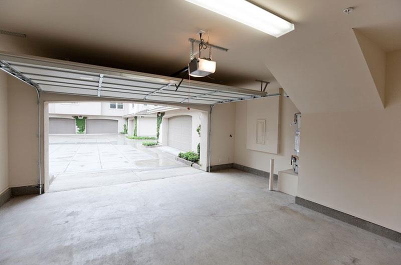 Residential garage with an automatic opener fitted to the ceiling